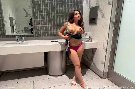 First timer Paris slips out of her dress to get naked in a public washroom - Photo 10