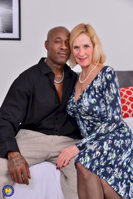 Mature blonde lady takes it up the ass from a younger black lover - Photo 1