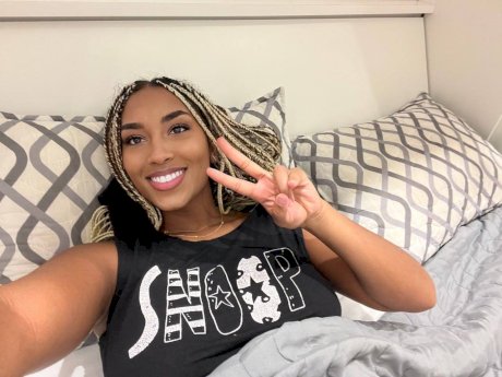 Ebony solo model Laila Santiagoo sports a nice smile during SFW action