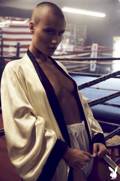Athletic woman Vendela models semi-nude in boxing attire with a sweat on