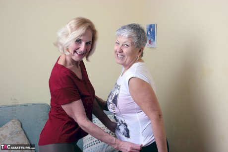 Old lesbians suck on each others boobs after modeling fully clothed
