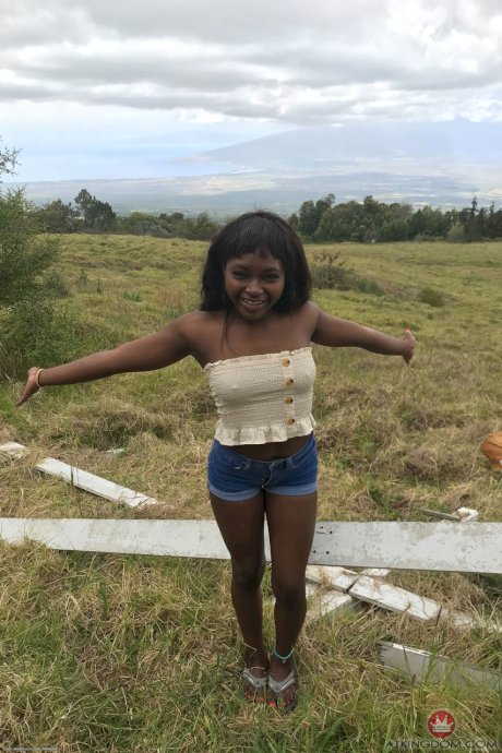 Petite ebony Noemie Bilas exposing her tits, pussy and feet in a solo