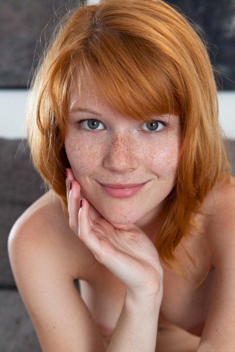 Czech teen Mia Sollis displays her cute freckled face & bald pussy up close