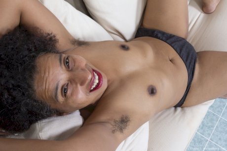 Curly haired ebony amateur Divine touches her hairy pussy after stripping