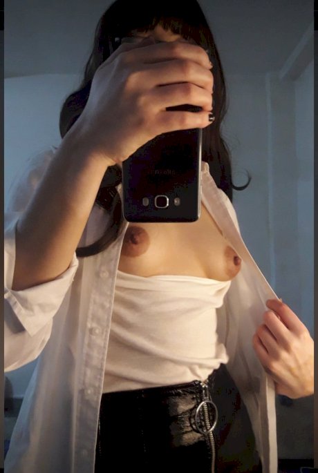 Solo girl takes selfies while showing her firm ass in a thong and stockings - Photo 5