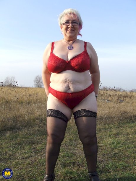 Wild granny with huge saggy tits Silke poses in lingerie & masturbates outside