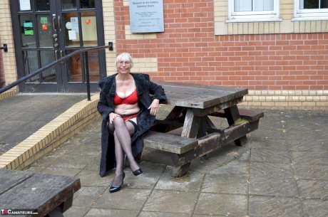 Older blonde amateur Barby Slut flashes while out in public places - Photo 1