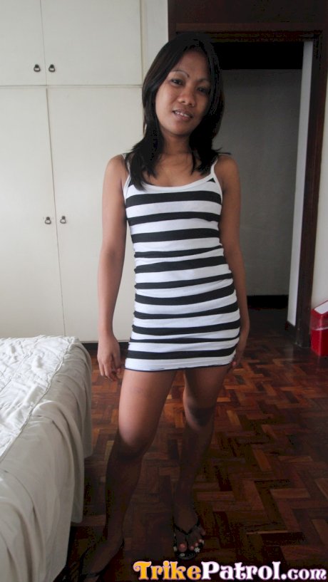Petite Asian girl undresses on her bed for her nude modeling debut - Photo 1