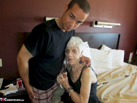 Really old woman gets fucked by her toy boy in black nylons and lingerie