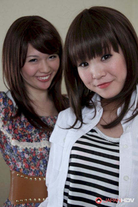 Japanese lesbians Rimu Endo & Ueno Misaki uncovers small tits as they disrobe