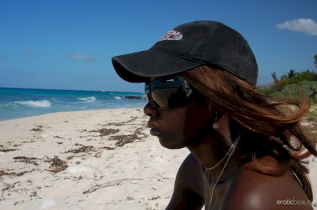 Ebony small tit babe Maria L gets naked at the beach and exposes her dark cunt
