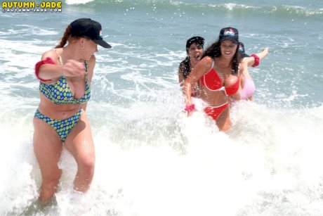 Huge boobed American stunners get wet and naked on the sandy beach
