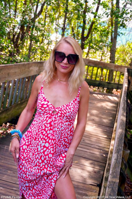 Skinny blonde Ally gets totally naked on a public beach in sunglasses