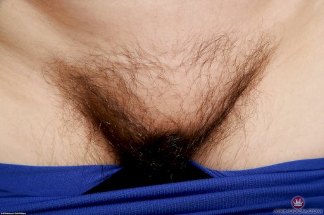 Mature fatty in glasses showing off hairy underarms and fleshy breasts