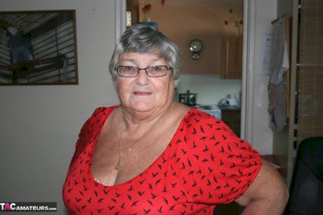 Obese nan Grandma Libby parts her shaved pussy after removing satin underwear