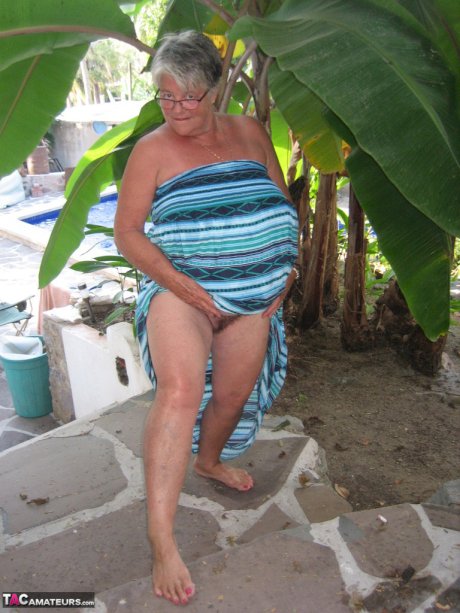 Old woman Girdle Goddess smokes before exposing her fat body on her patio