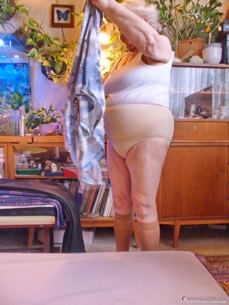 Fat old granny Galfira undresses and poses naked in a solo show