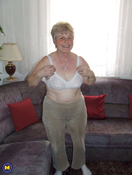 Chubby blonde granny Petra doffs her clothes and flaunts her natural tits