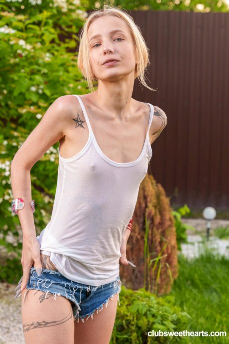 Slender European teen Tea Mint flaunts her tiny tits and masturbates outdoors