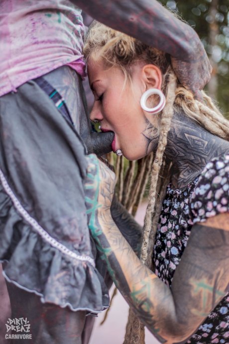 Heavily tattooed girl Lily Lu sucks on her boyfriend's tattooed penis