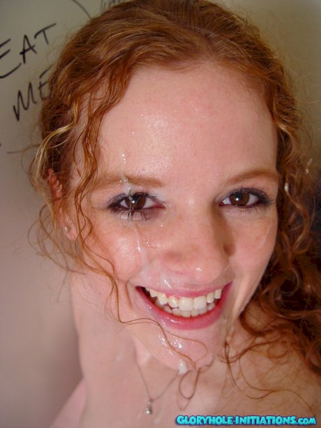 Young natural redhead Roxanna discovers gloryhole in bathroom & a cock as well