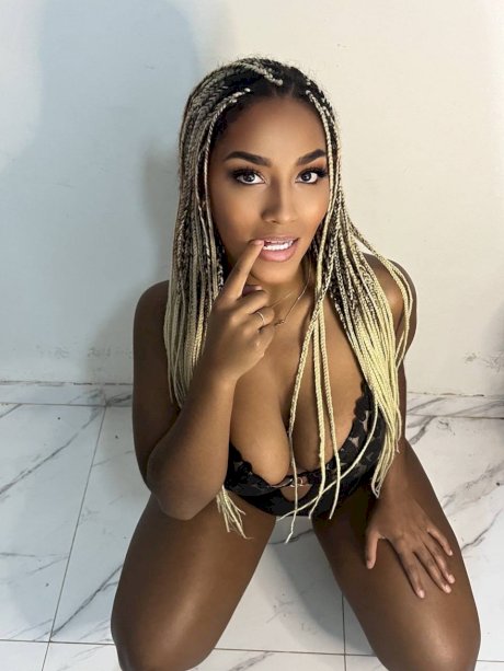 Ebony solo model Laila Santiagoo sports a nice smile during SFW action