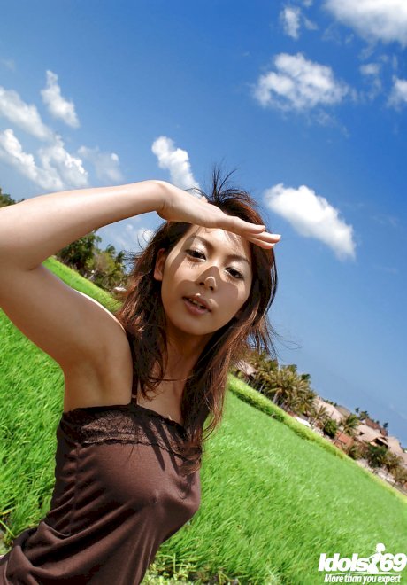 Fuckable asian babe in fancy dress uncovering her perky tits