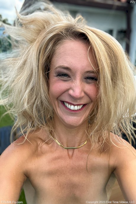 Skinny blonde Ally gets totally naked on a public beach in sunglasses