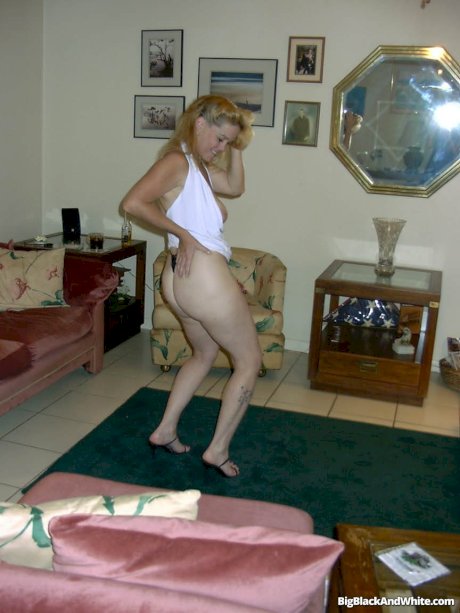 Blonde lady flaunts her big ass while fooling around with a black man