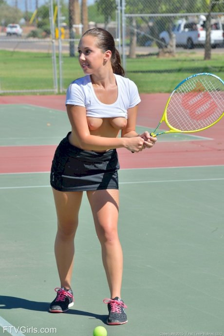 Teen tennis player inserts her racquet handle into her horny twat