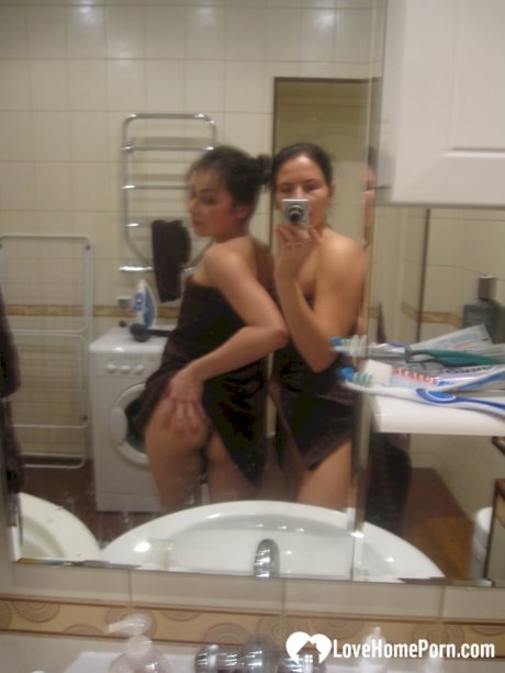 Hot amateur lesbians strip and make out while taking selfies in the bathroom