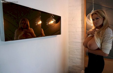 Busty MILF Kelly Madison gives handjob & flaunts massive big tits everywhere - Photo 1