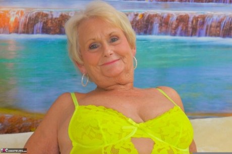 Blonde granny Sparkle looses her saggy tits from neon lingerie