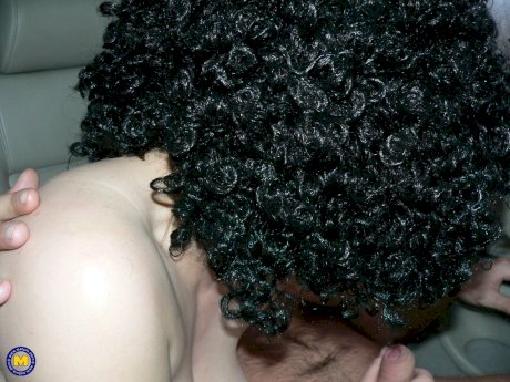 Curly-haired amateur prostitute with big tits Johanna sucks 2 dicks in public - Photo 1