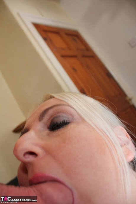 Blonde British woman Tracey Lain removes satin lingerie before POV sex