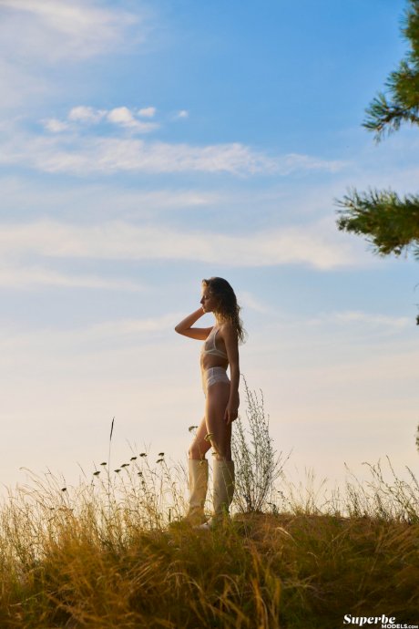 Ukrainian babe Megan Venturi stripping and posing nude in beautiful nature