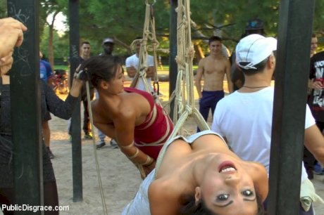 Beautiful girls are tied together during a public humiliation session - Photo 11