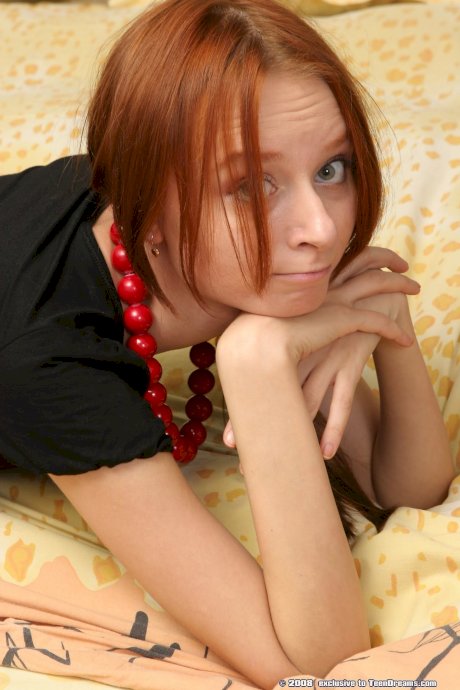 Skinny redheaded teen Vika slowly strips and poses butt naked on the bed - Photo 12