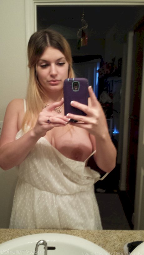Big boobed amateur Danielle takes naked selfies around the house