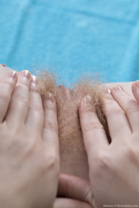 Amateur American Milasha stripping & spreading her hairy pussy on a blue towel - Photo 17