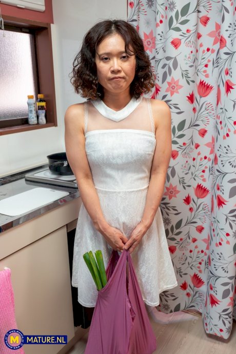 Mature housewife with a shaved pussy and firm tits in the kitchen having sex porn pics