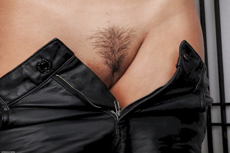 Latina Mena takes off her leather shorts to show us her hairy hole