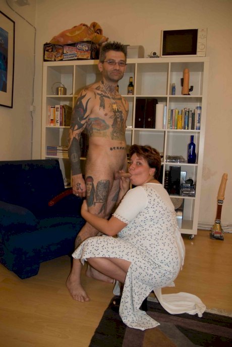 Amateur BBW Renate Zug fucks a tattooed man in the ass with a strap on cock