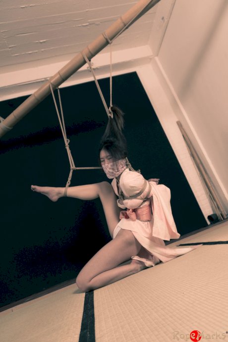 Asian chick Flawless Meow is tied with rope by her limbs and hair