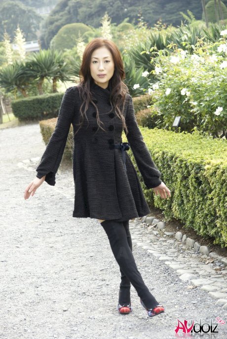 Fully clothed Japanese teen models in the park in black clothes and stockings
