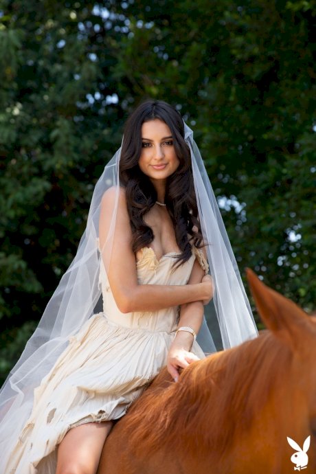 Gorgeous brunette babe Eliza Ibarra shows her body while riding a horse