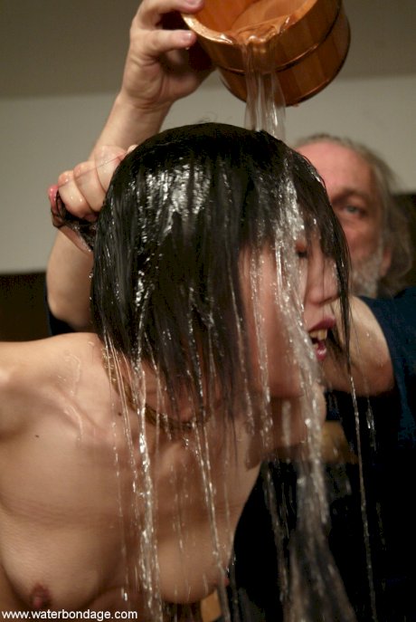 Asian girl Ageha Asagi getting masturbated in a BDSM water play scene