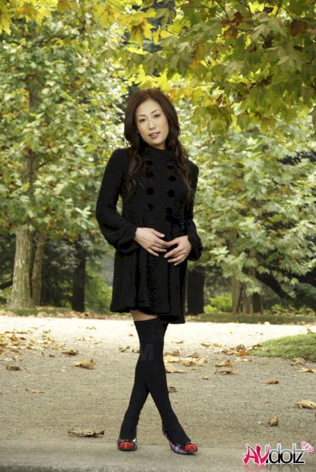 Fully clothed Japanese teen models in the park in black clothes and stockings