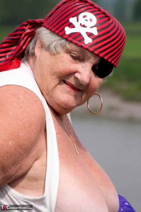 Fat British granny exposes herself on a bridge while sporting pirate attire