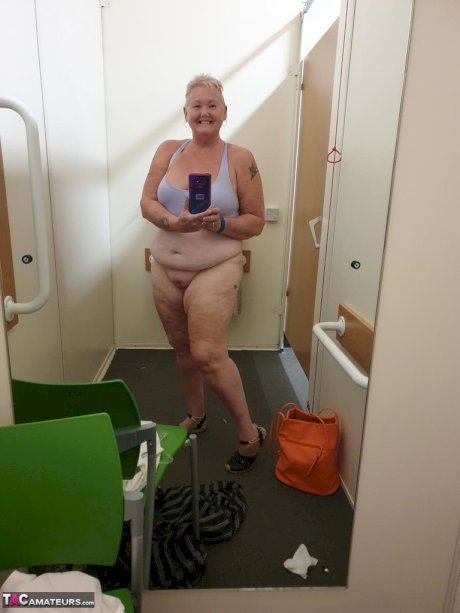 Fat granny with red hair Valgasmic Exposed takes naked selfies at home